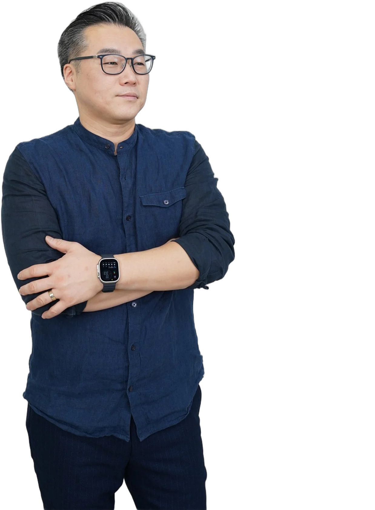Jae Cho, arms crossed, in a navy shirt